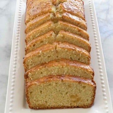 sliced maple ginger pound cake on white serving tray