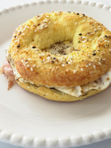 Low carb egg bagel sandwich on white plate