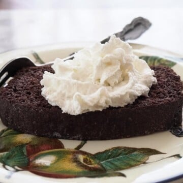 low carb chocolate quick bread with whipped topping on plate