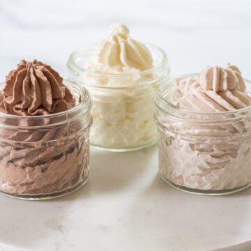 coconut, chocolate, raspberry keto whipped cream in mason jars.