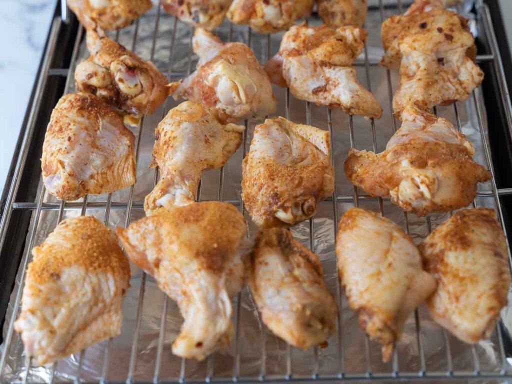 seasoned chicken wing on rack