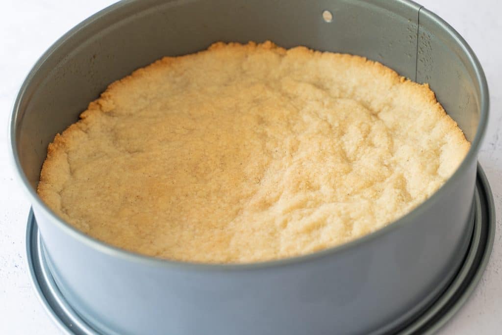 baked almond crust in springform pan