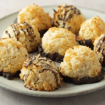 Keto Coconut Macaroons dipped in chocolate on white plate