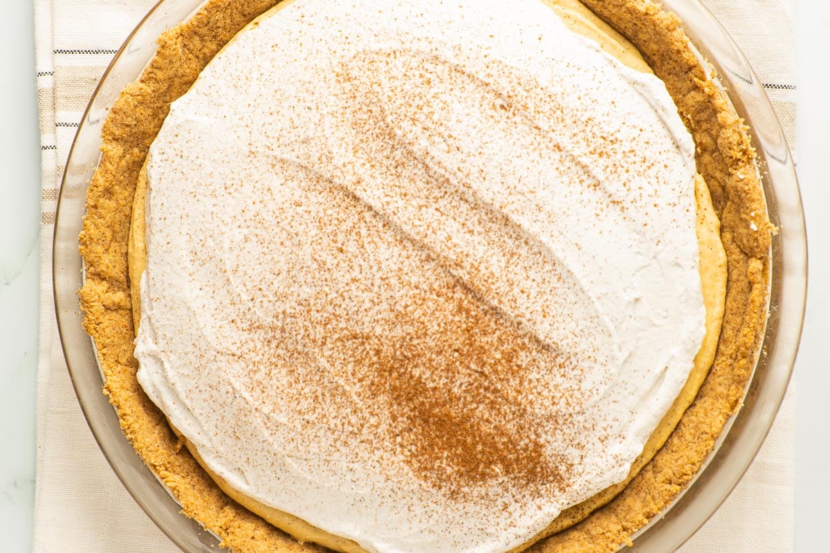 keto pumpkin mousse pie with cinnamon topping.