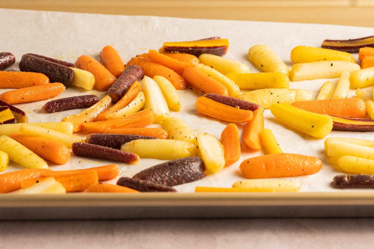 rainbow carrots on baking tray.