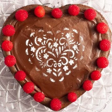 keto heart shaped chocolate cheesecake on platter.