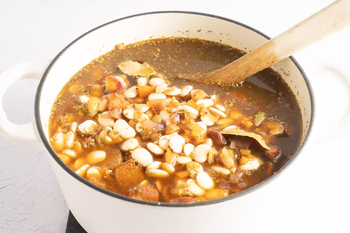 uncooked lima bean soup in pot.