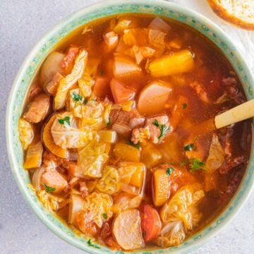 brussels sprout soup in green bowl.