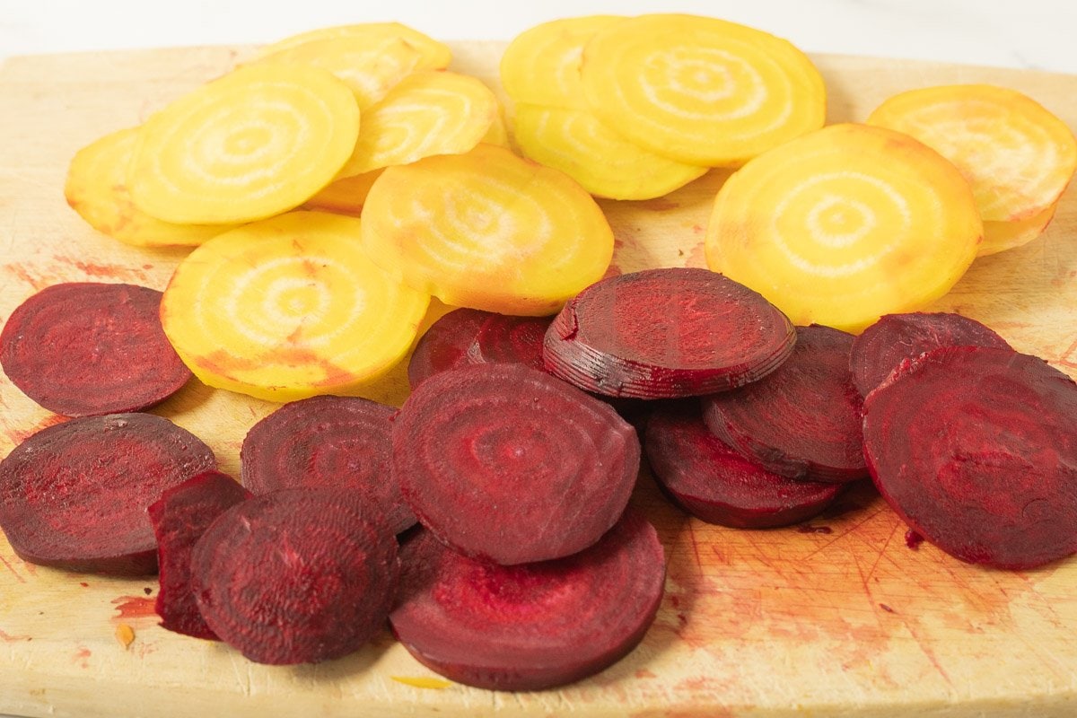 sliced beets on cutting board.