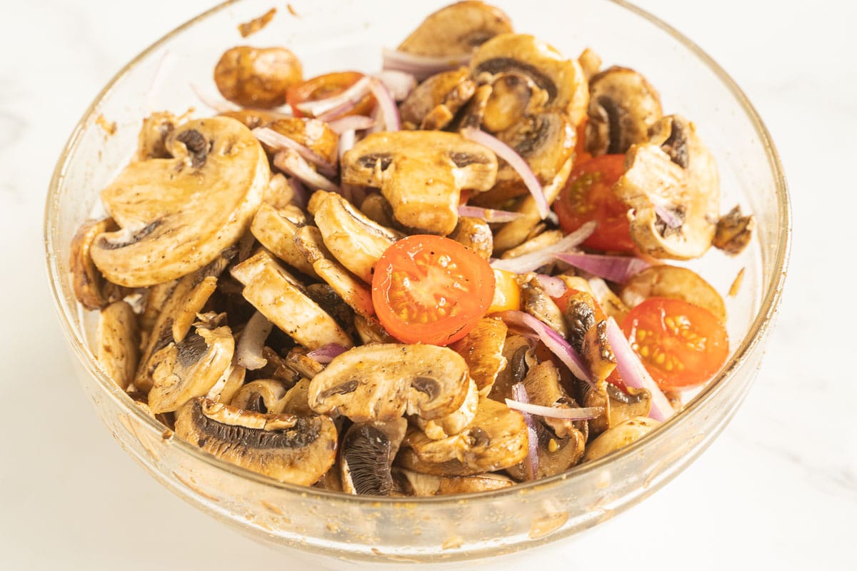 Mushroom salad in glass bowl.