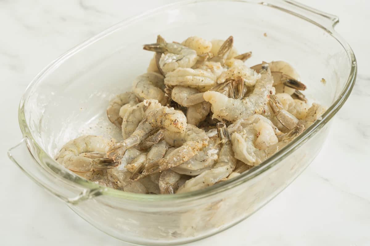 Seasoned shrimp in glass bowl.