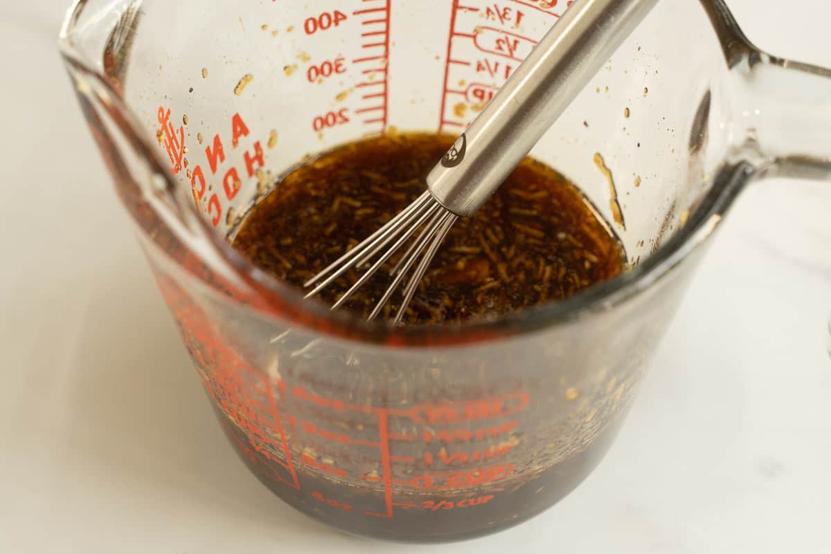 Marinade and whisk in measuring cup.