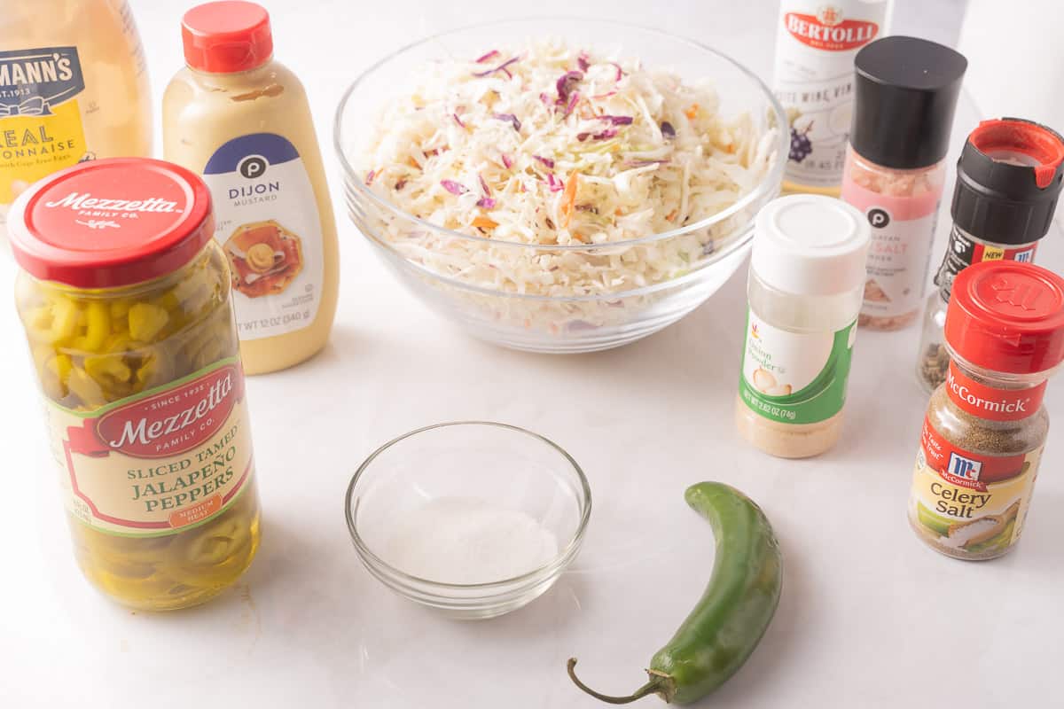 Coleslaw, mustard, Jalapeno, pickled Jalapeno, garlic, paprika, celery salt, vinegar, sugar.