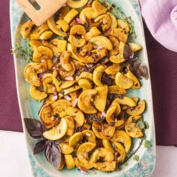 Fried yellow squash on green platter.