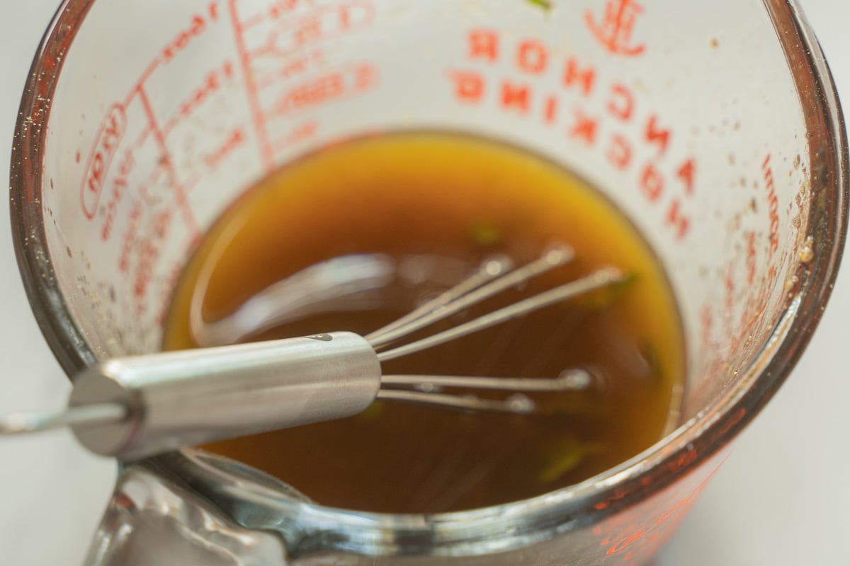 Marinade in glass measuring cup.