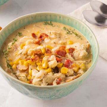 Crab and corn bisque in green bowl.