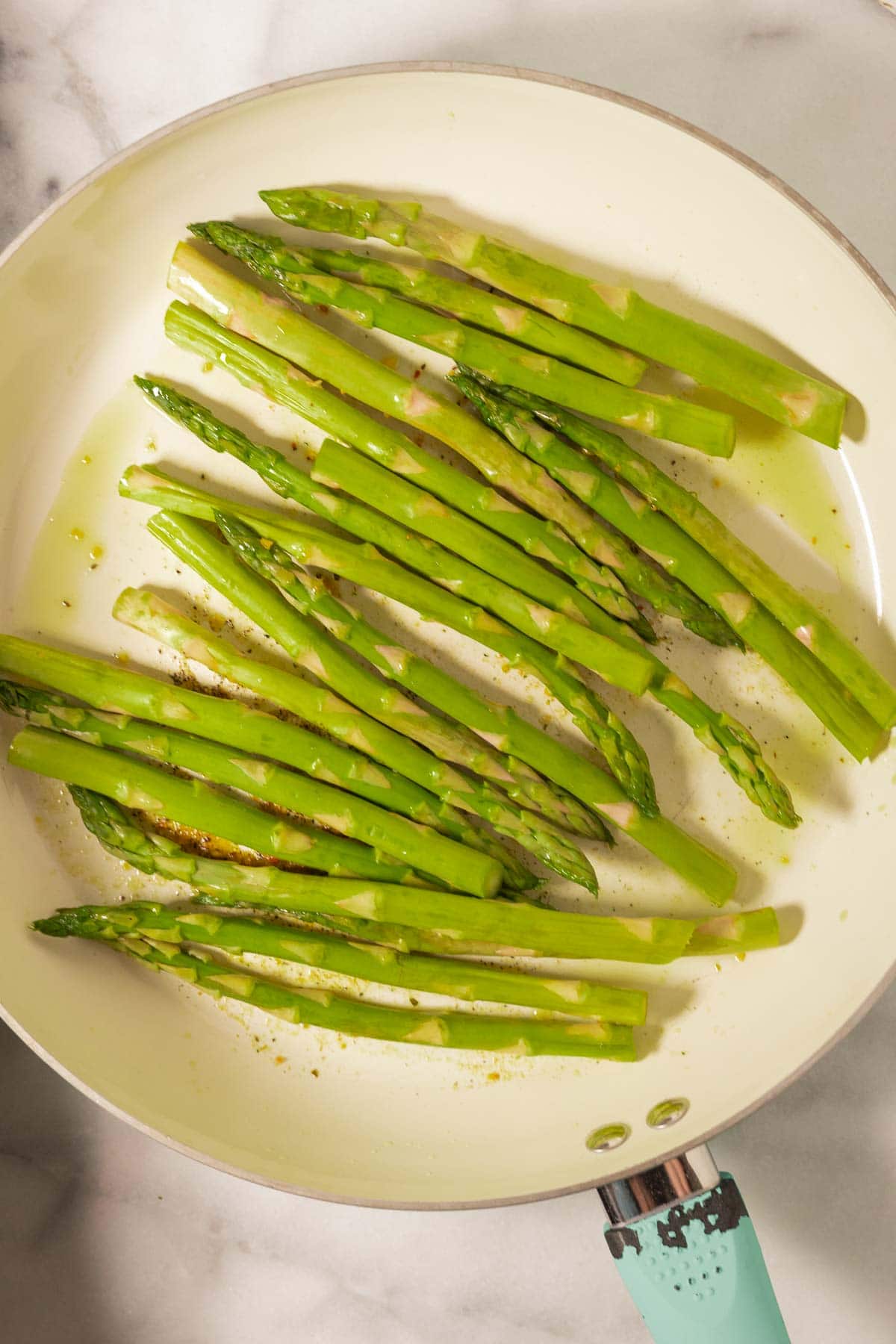Asparagus spears in skillet.