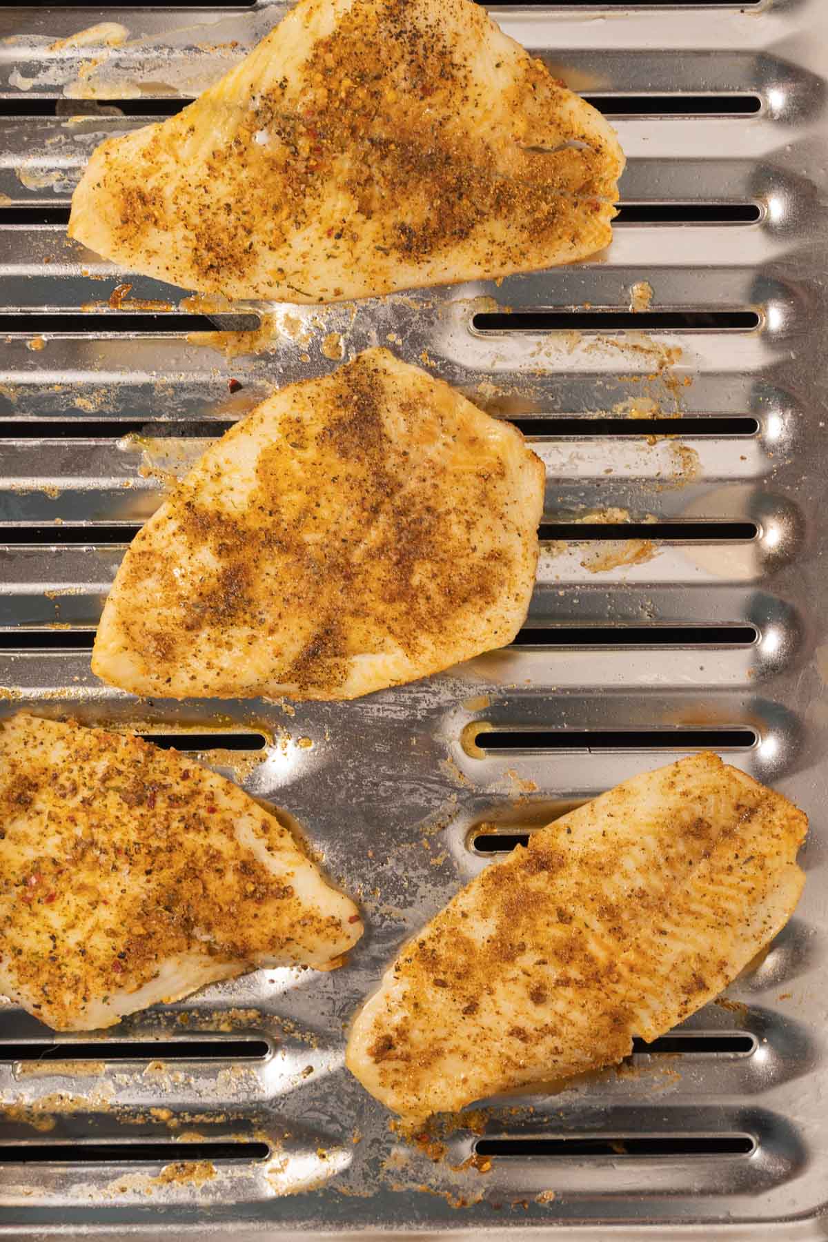 Broiled flounder on broiler pan.