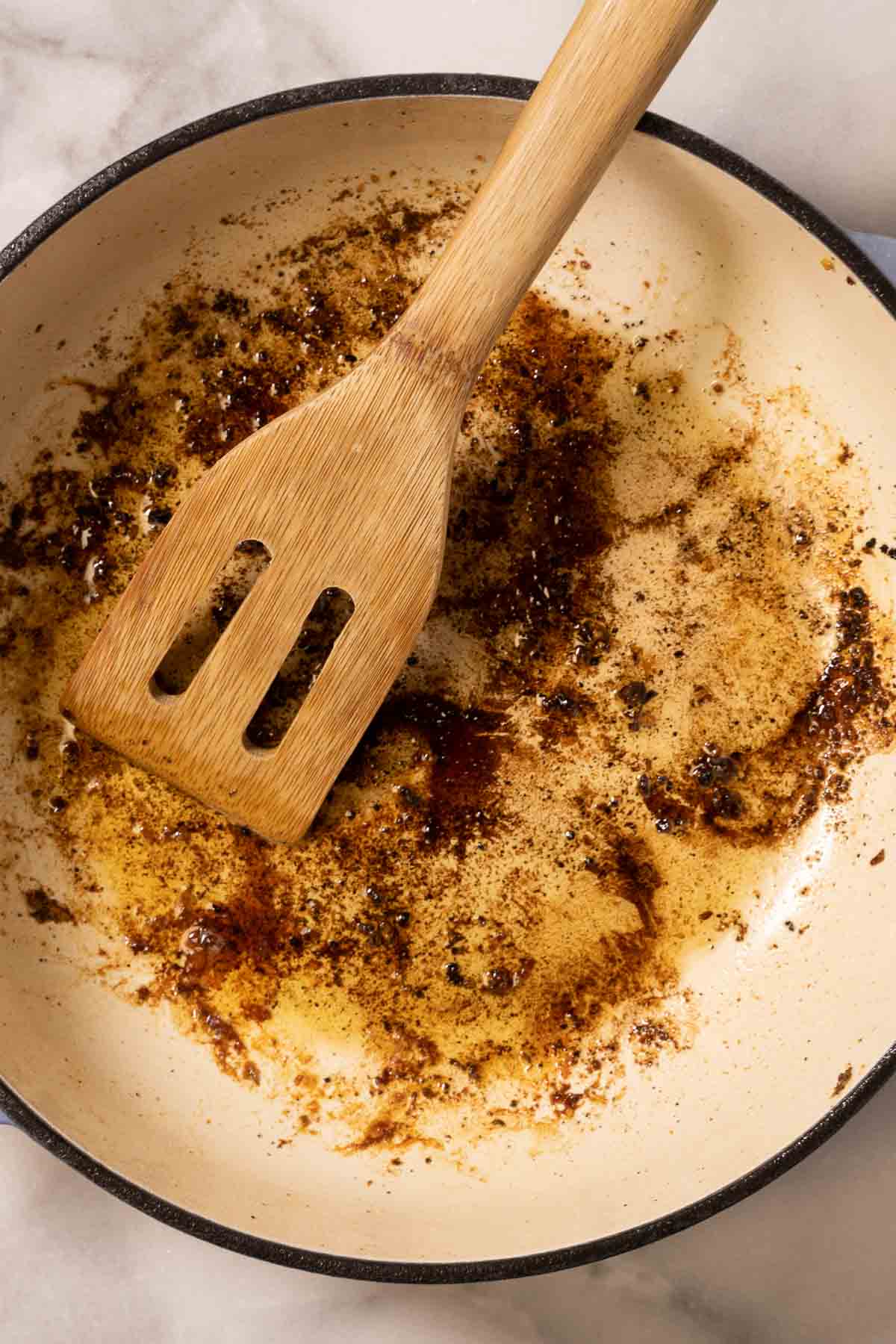 Cooking garlic in skillet.