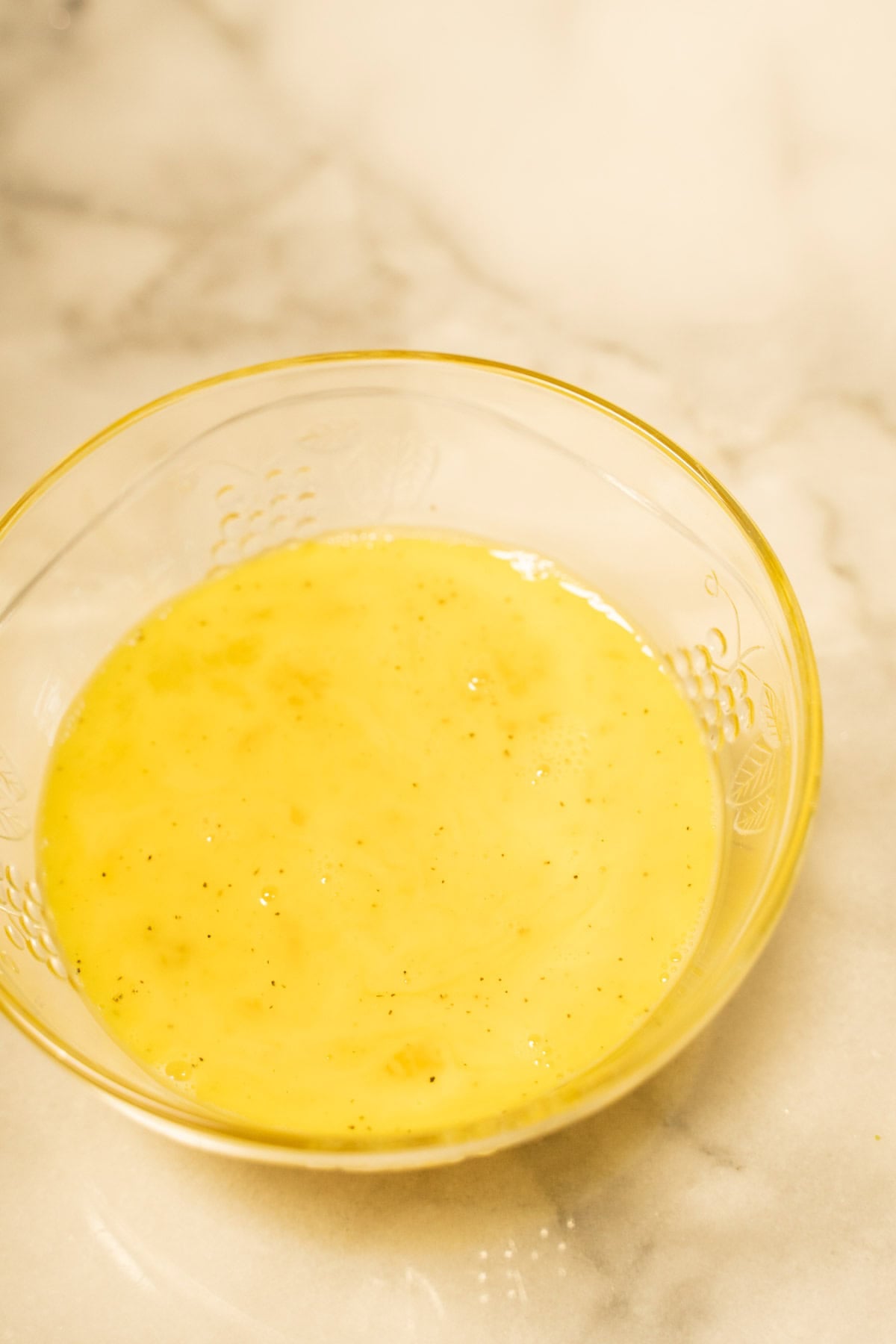 Whisked eggs in bowl.