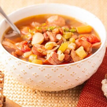 Slow Cooker 15 Bean Cajun Soup in white bowl.