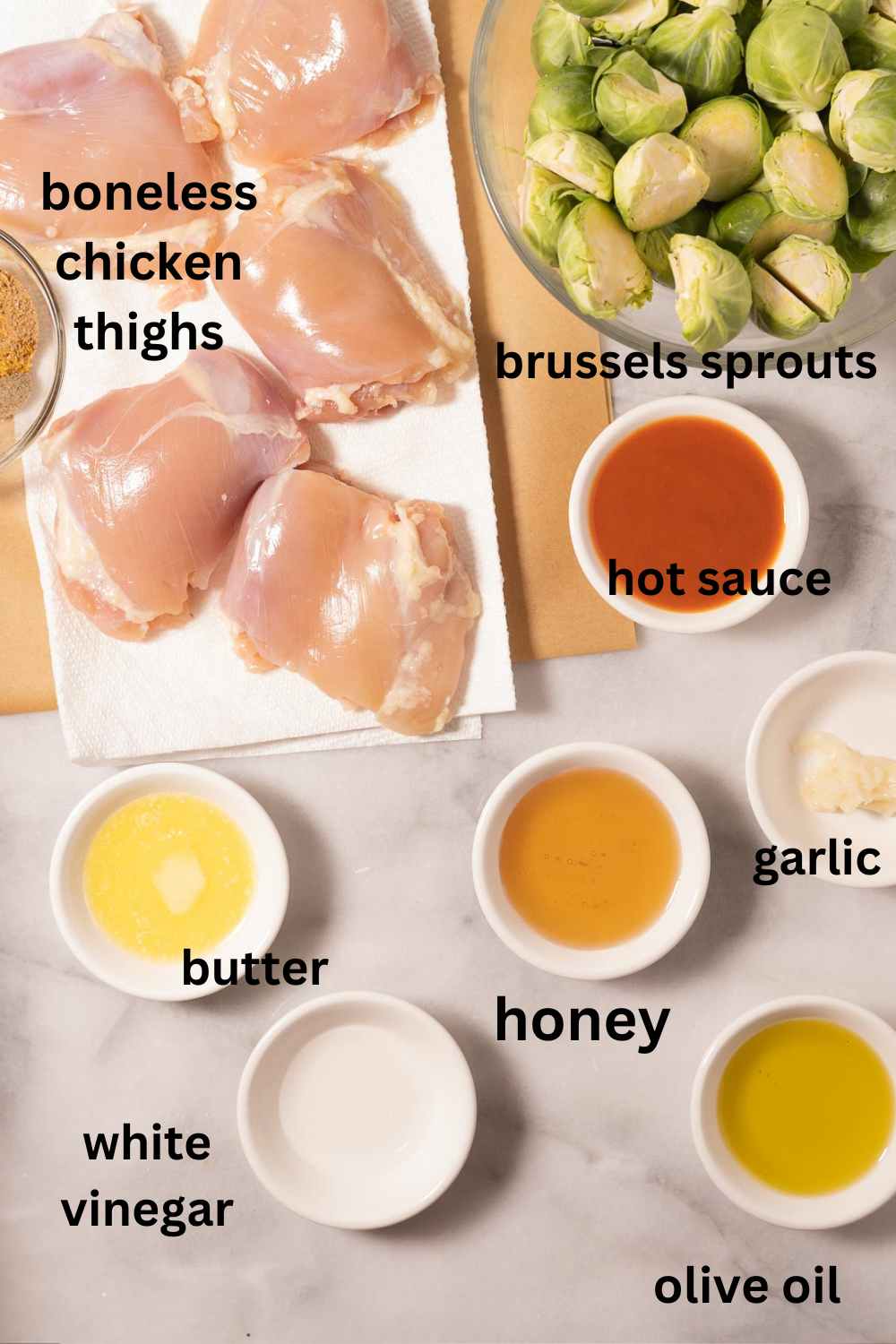 Chicken thighs, honey, vinegar, hot sauce, garlic, brussels sprouts, oil.