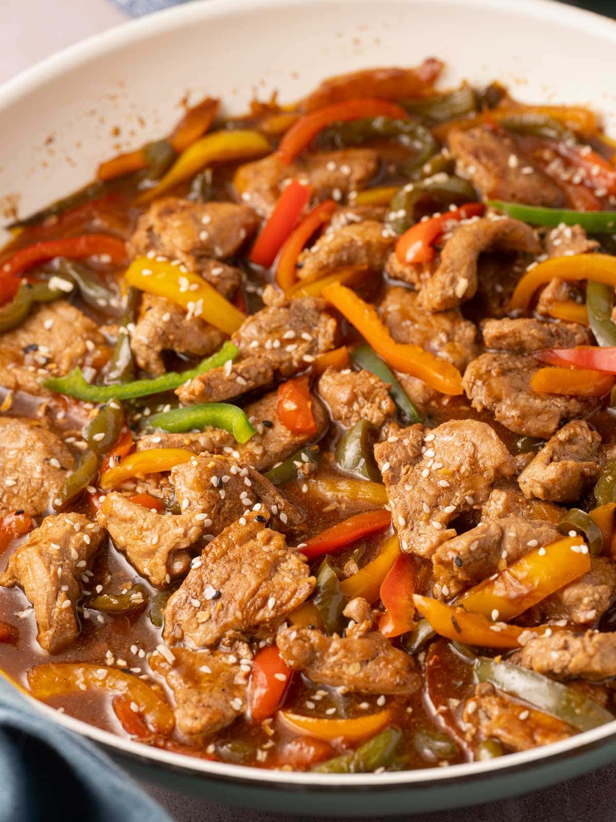 Pork tenderloin stir fry in skillet.
