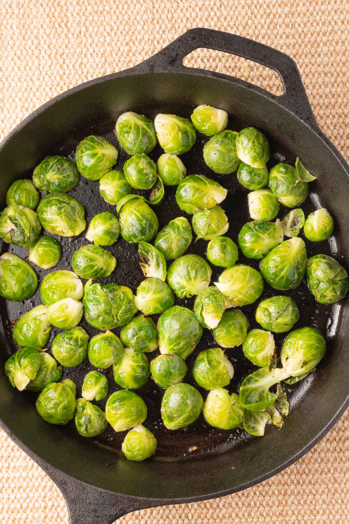 Marinated brussel sprouts in cast iron skillet