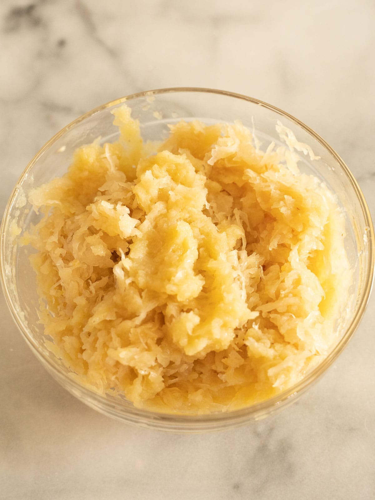 Sauerkraut and apple sauce in glass bowl.