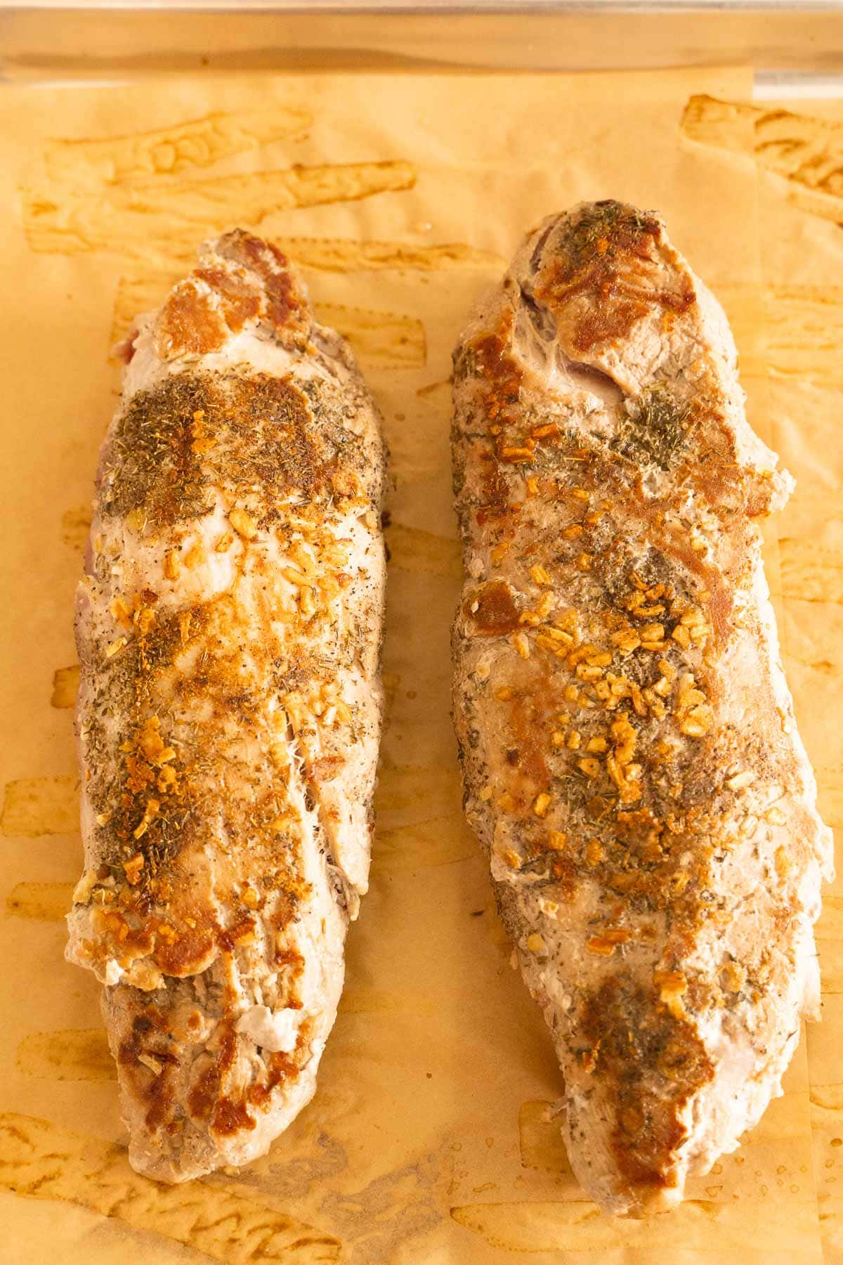Browned seasoned pork tenderloins.