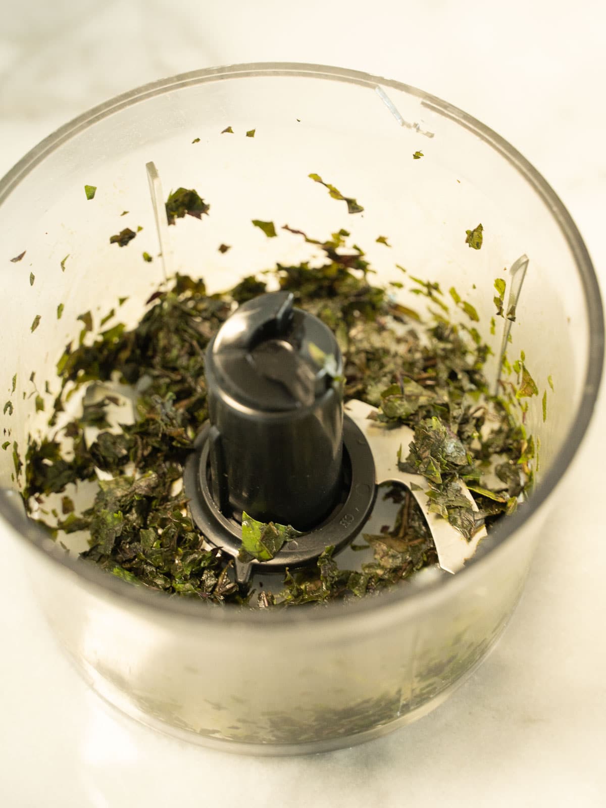 chopped basil in processor,