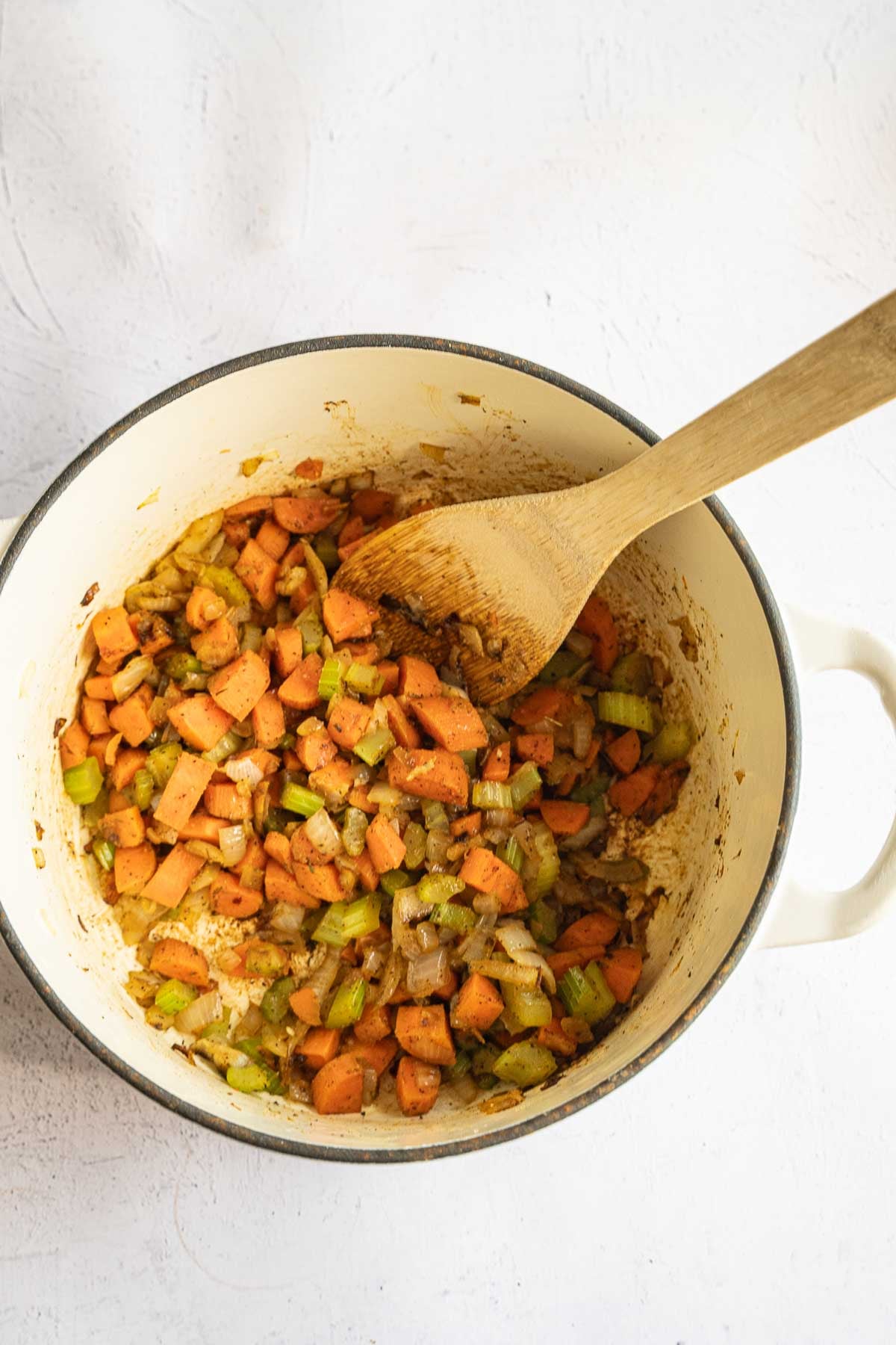 Chopped onion, carrots, celery in large pot.