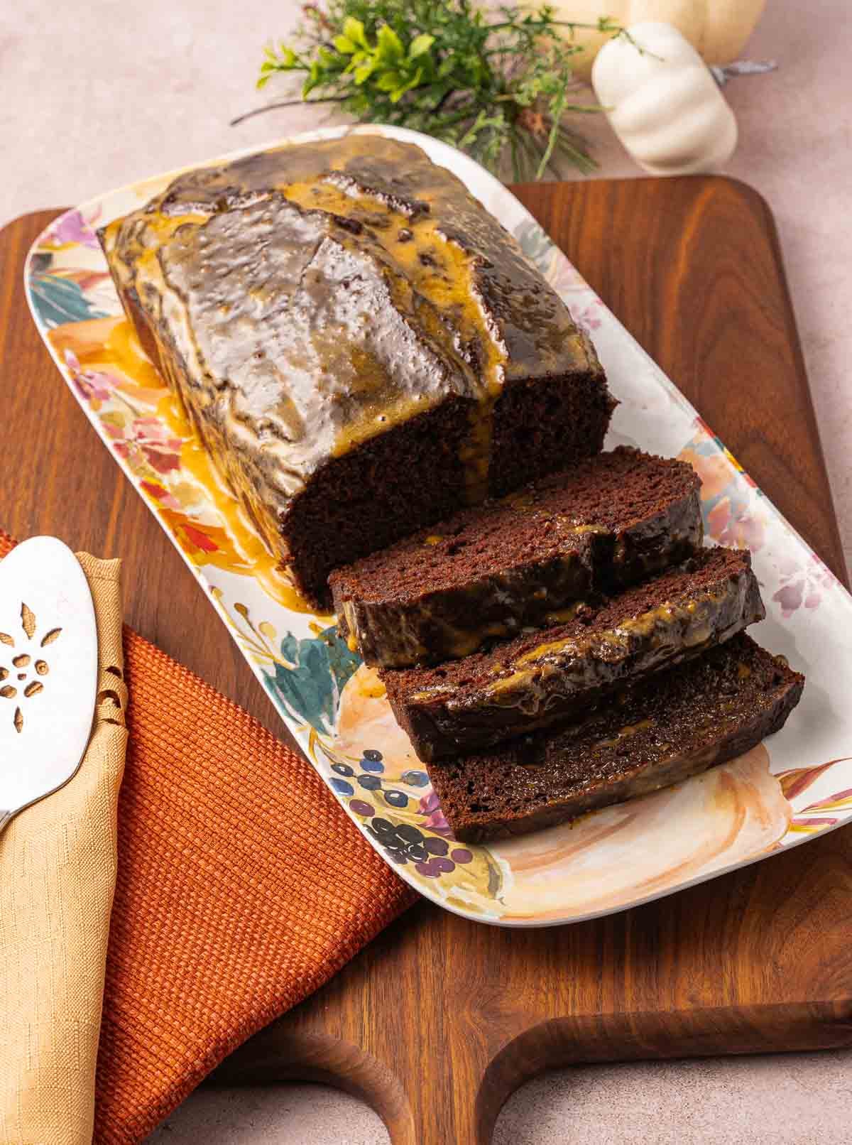 Chocolate Pumpkin Bread with Pumpkin Glaze on platter.