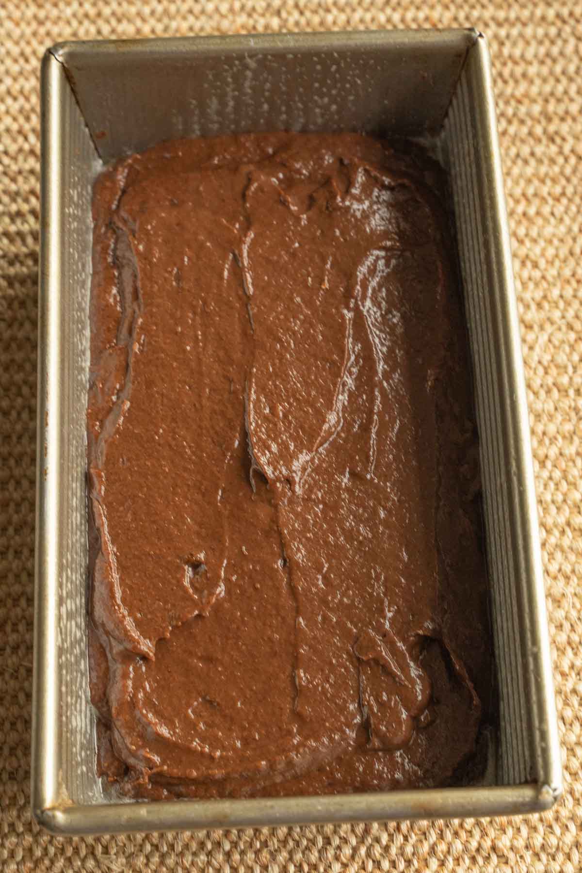 Chocolate pumpkin bread batter in loaf pan.