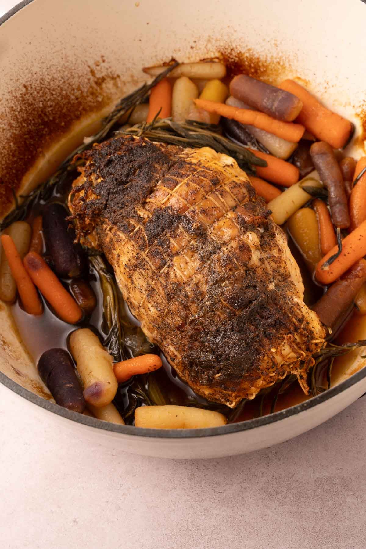 Roasted turkey breast, carrots, celery and seasonings in dutch oven.