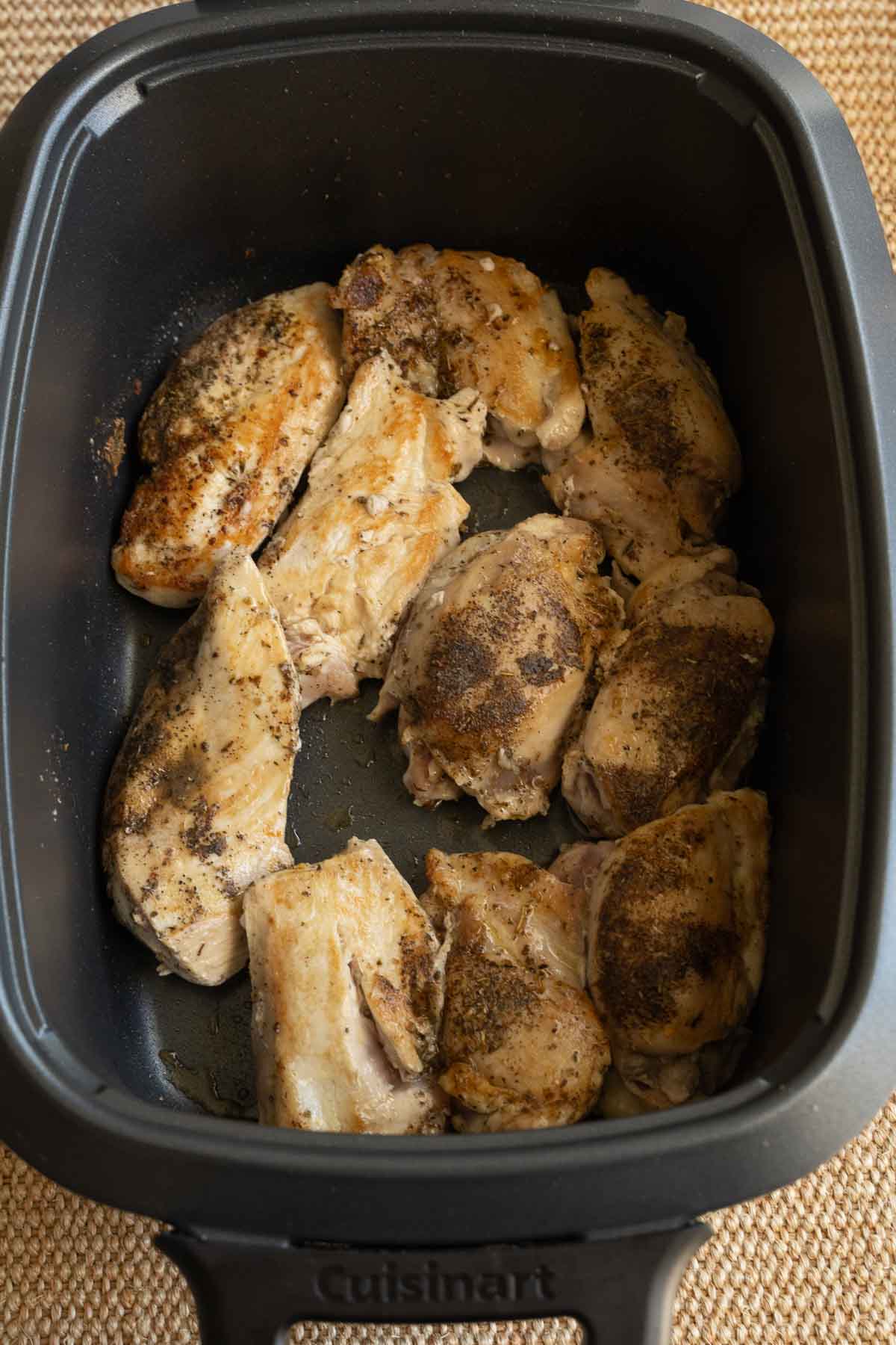 Browned chicken thighs in slow cooker.