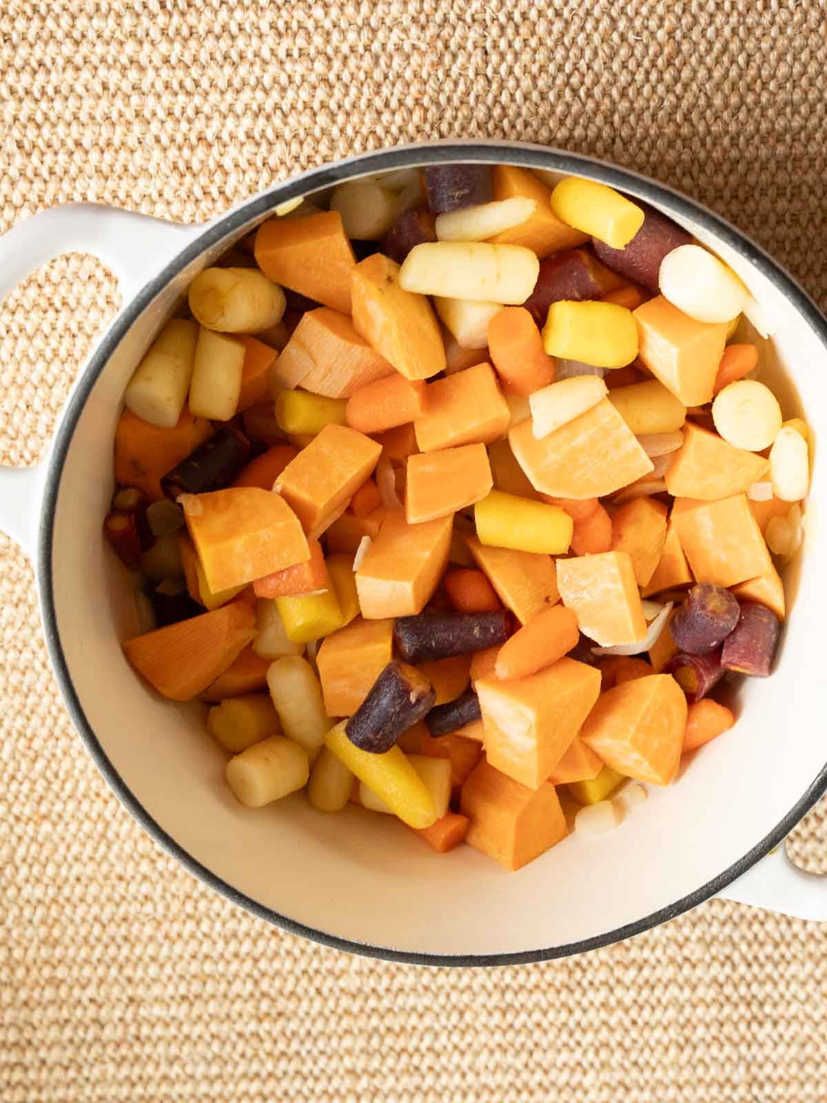 Cubed carrots and sweet potatoes in large pot.