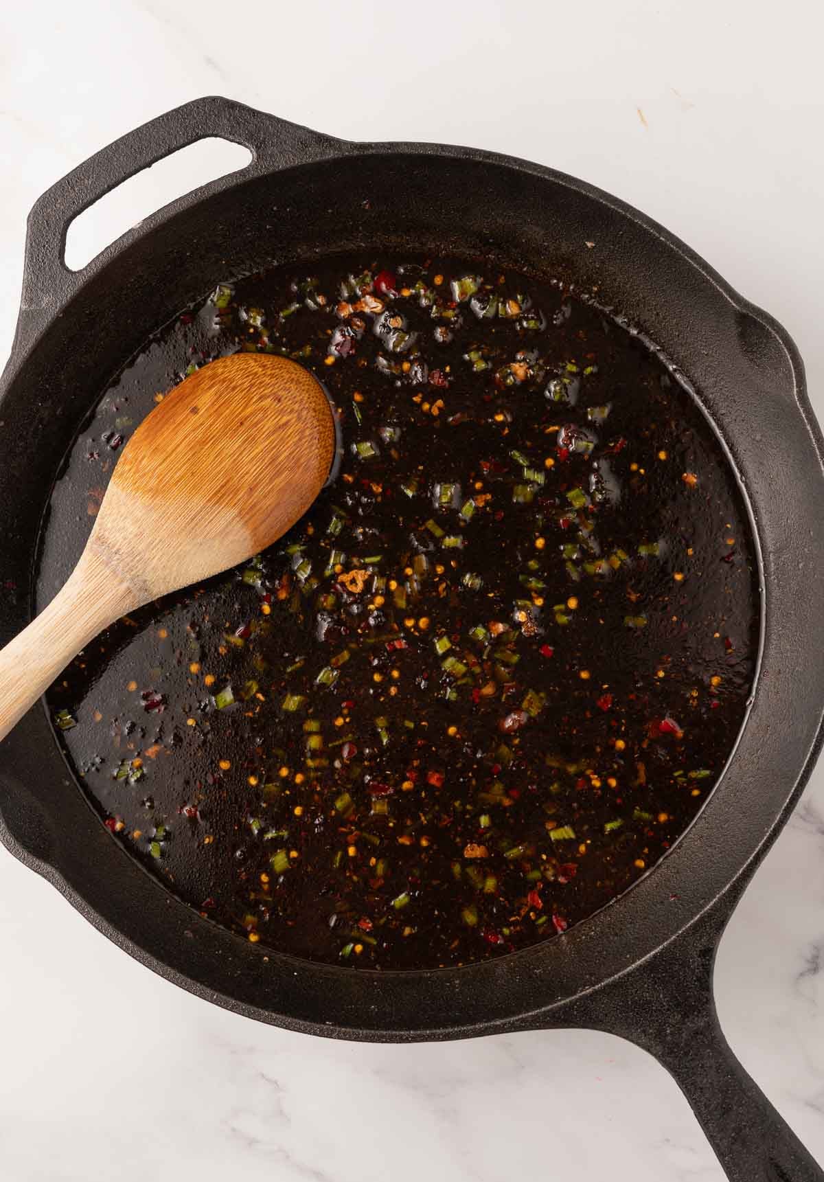 Thai Basil sauce simmering in skillet.