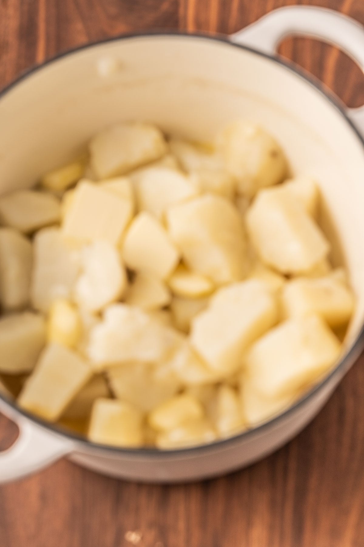 Cooked Russet potatoes in large pot.