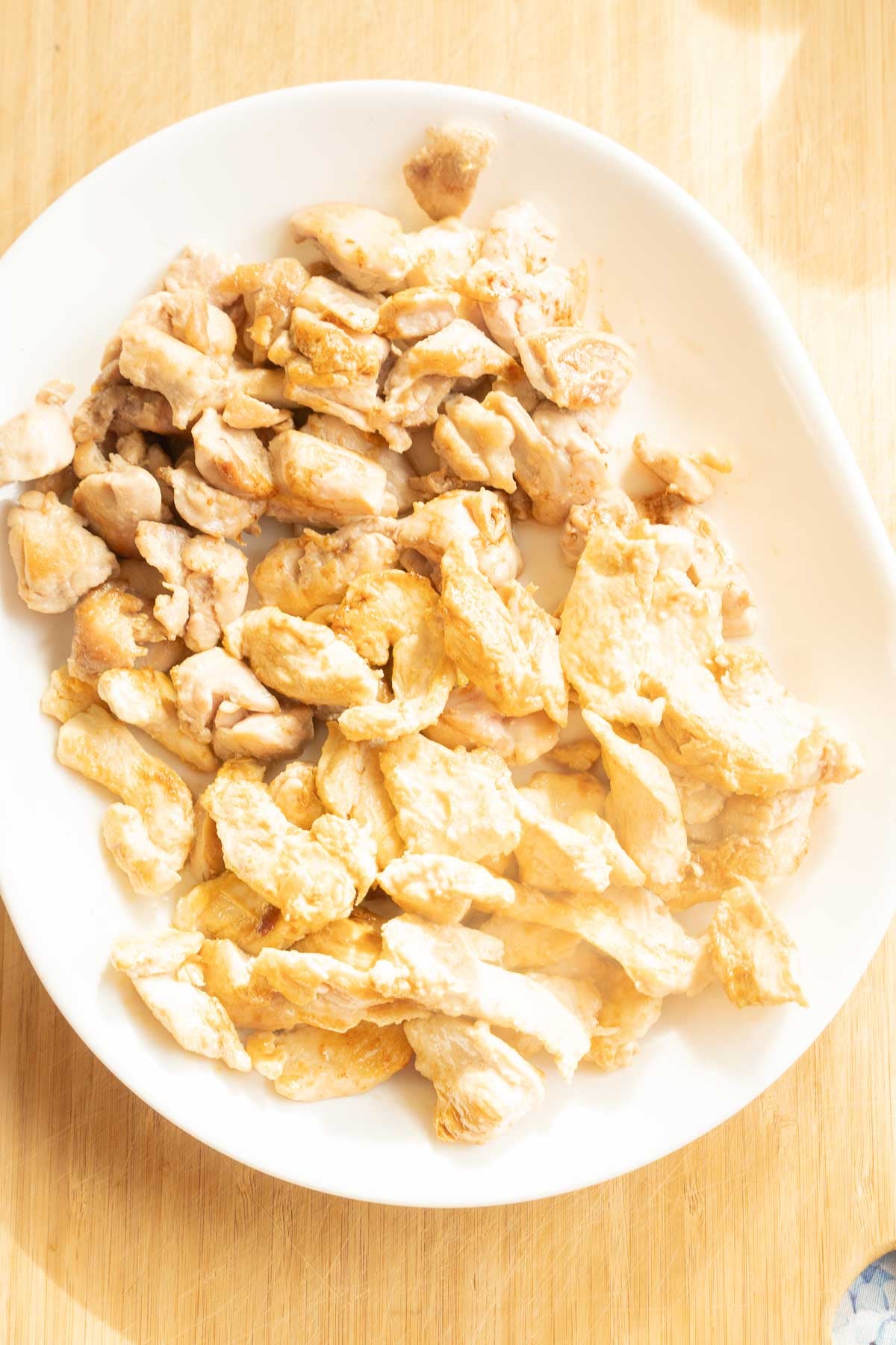 Pan frying chicken pieces in skillet.