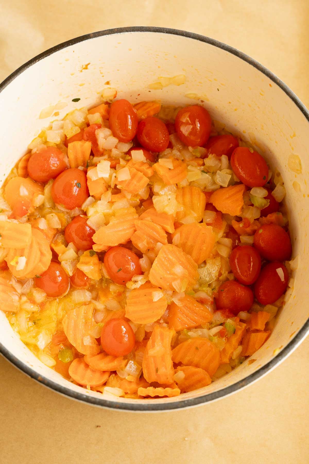 Chopped vegetables in large pot.