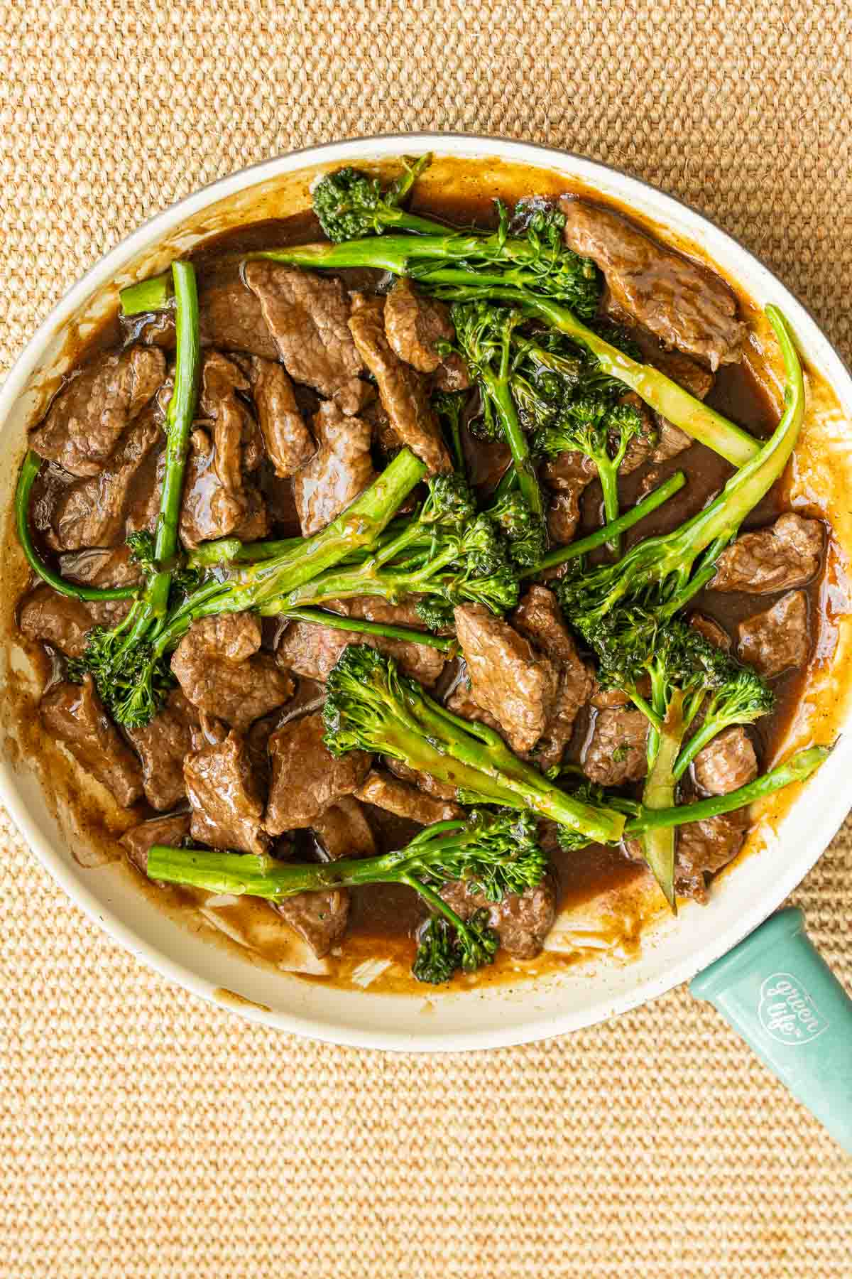 Beef and Broccolini Stir Fry with sauce in skillet.