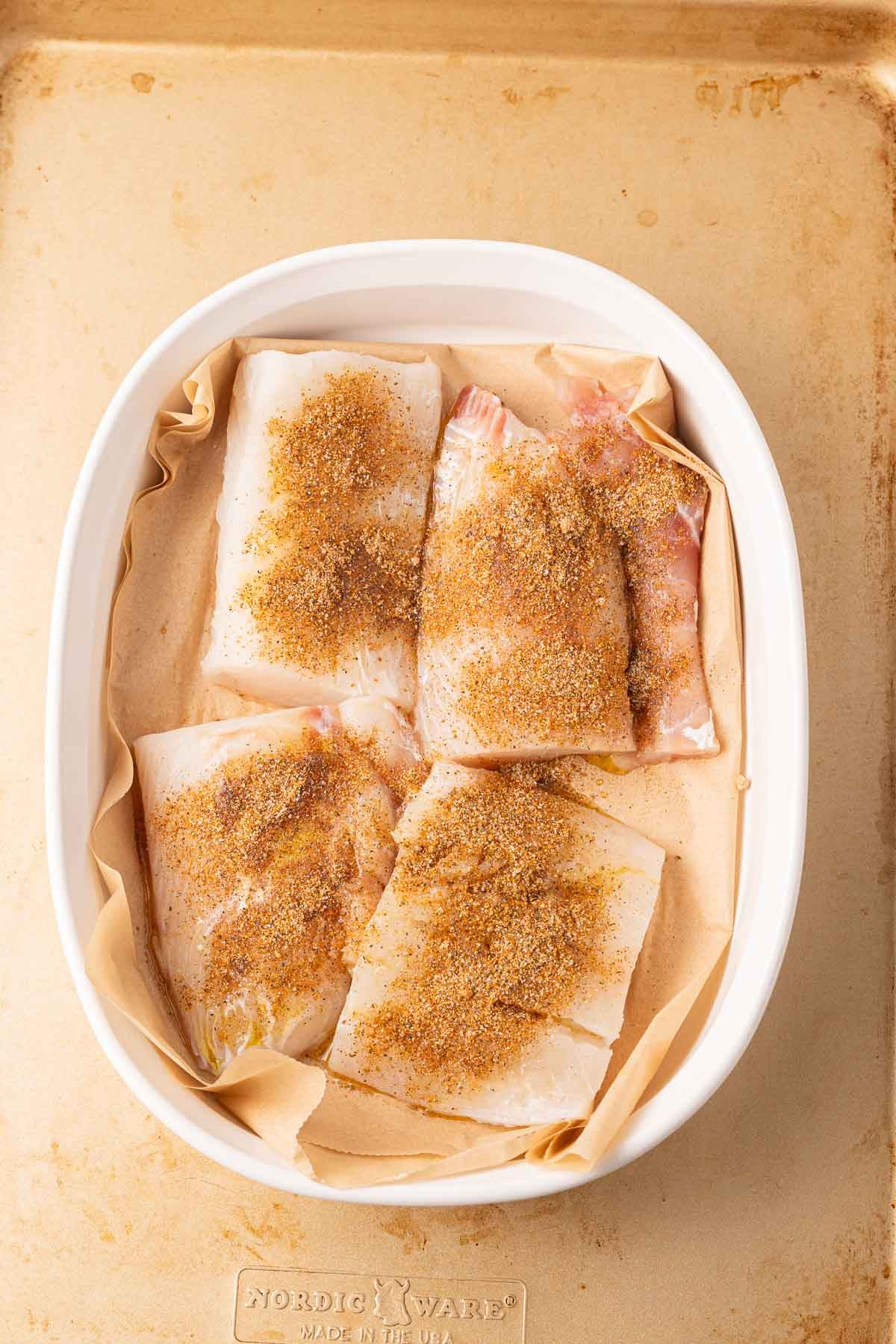 Seasoned Atlantic haddock filets in bowl.
